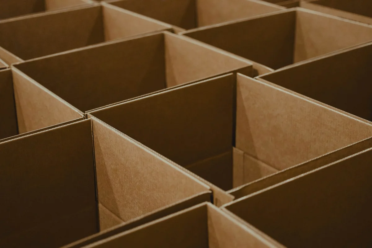 Open cardboard packaging boxes arranged for packing